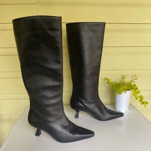 Ana Palma black leather slip on boots with pointed toe and low heel